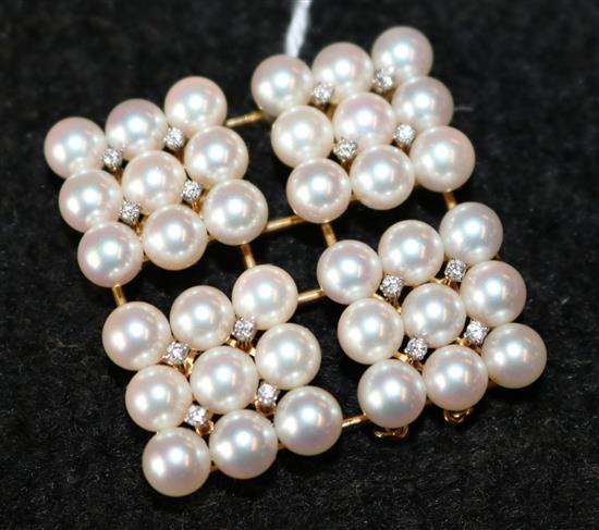 An 18ct and 14ct gold, cultured pearl and diamond pendant, 2in.